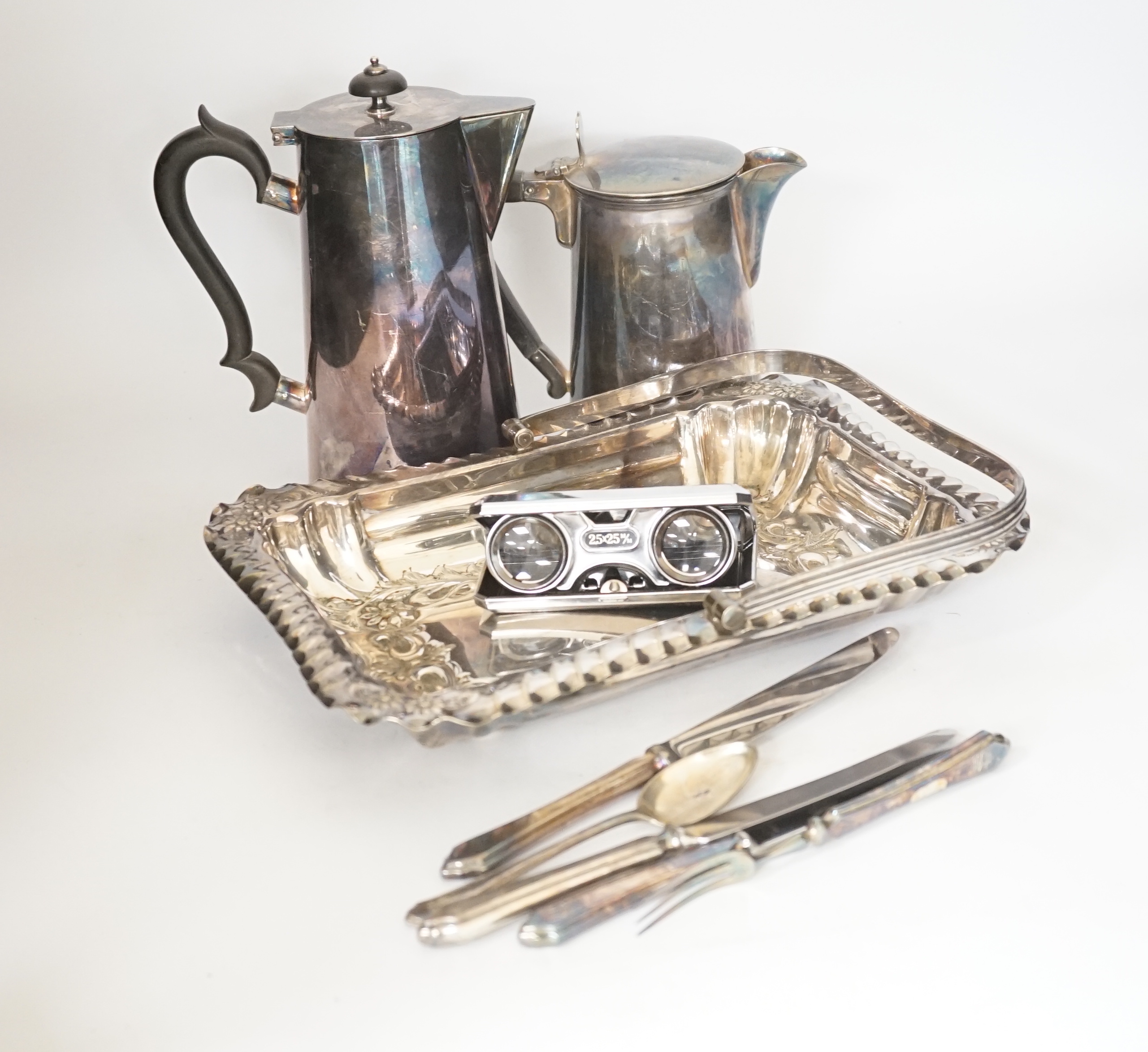 A large quantity of various patterned plated cutlery, a basket and two pots, etc.